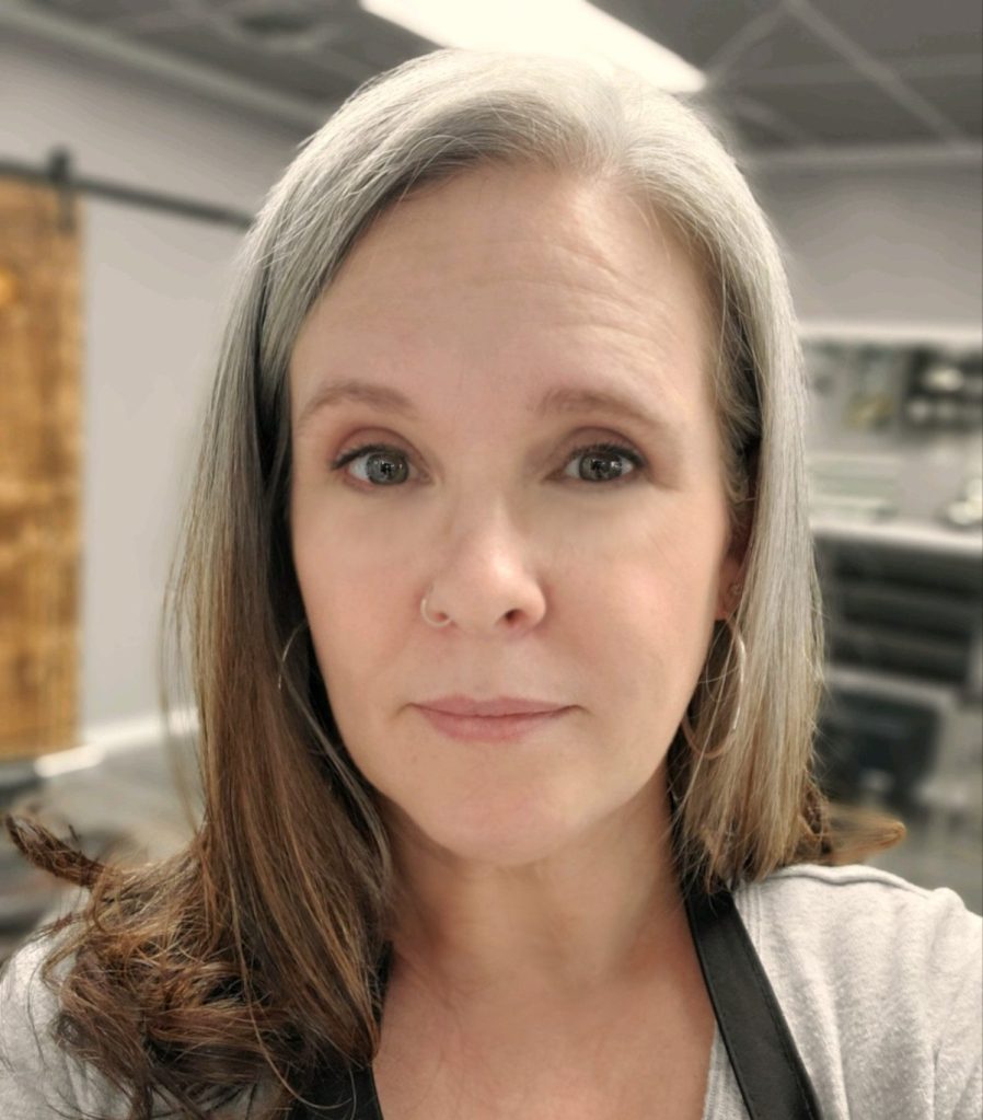 A photo of Kim in the shop.